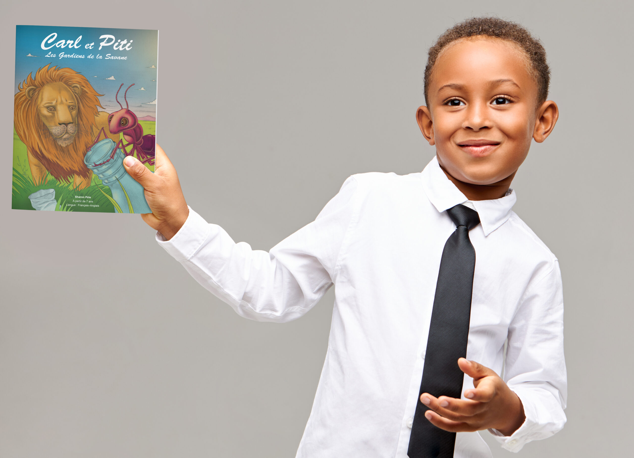 Carl et Piti cheerful cute afro american schoolboy in shirt and tie smiling happily using electronic gadget to play games or watch cartoons, holding digital tablet with blank display with copyspace for your text
