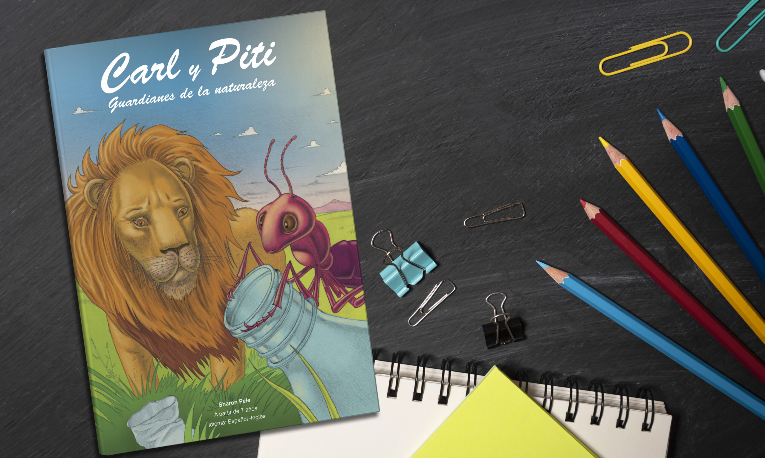 Carl y Piti back to school. accessories, books and crayons on chalkboard bac