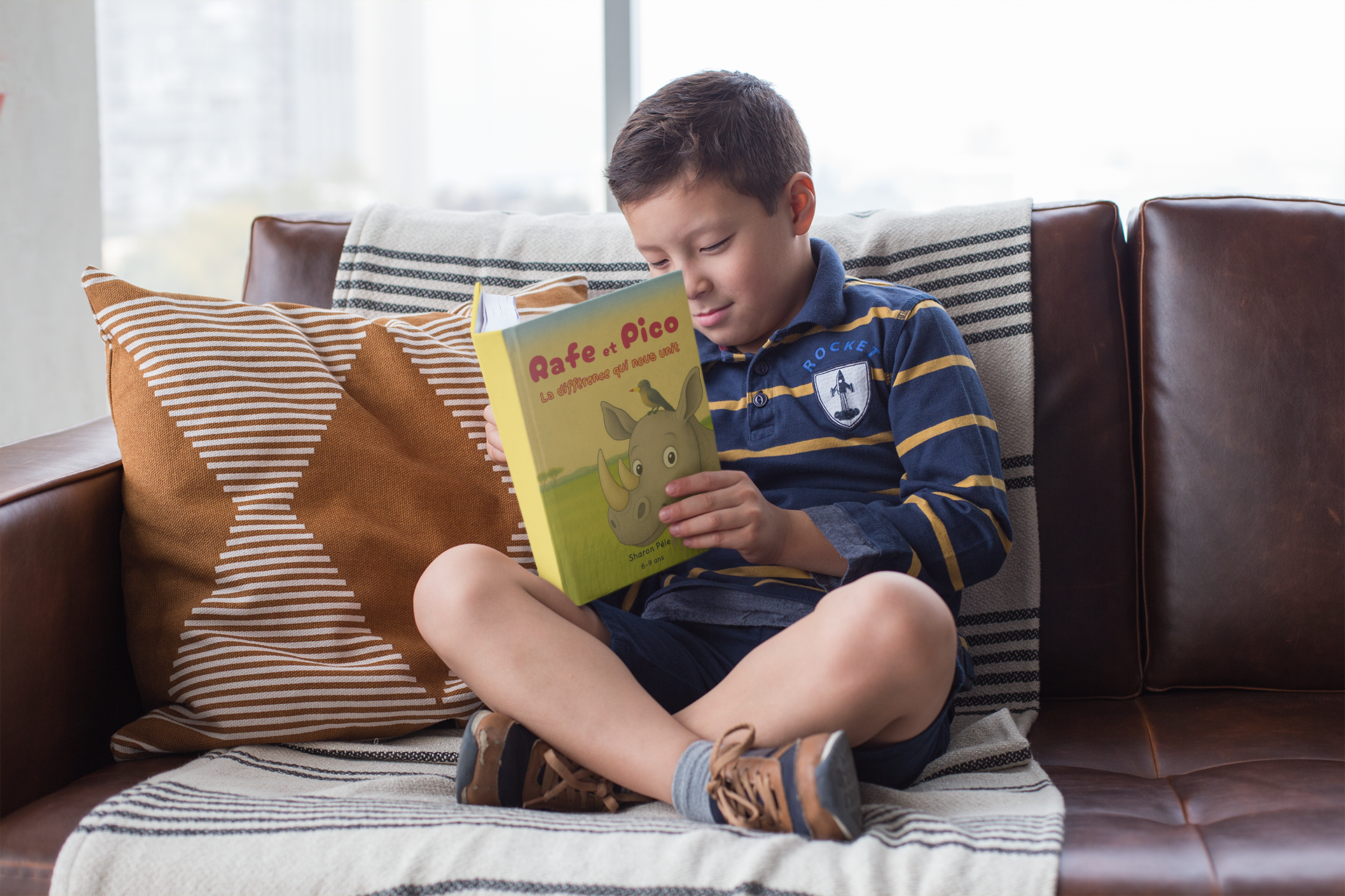 Rafe and Pico United by Our Differences mockup of an attentive young boy reading a book 23719 (1)
